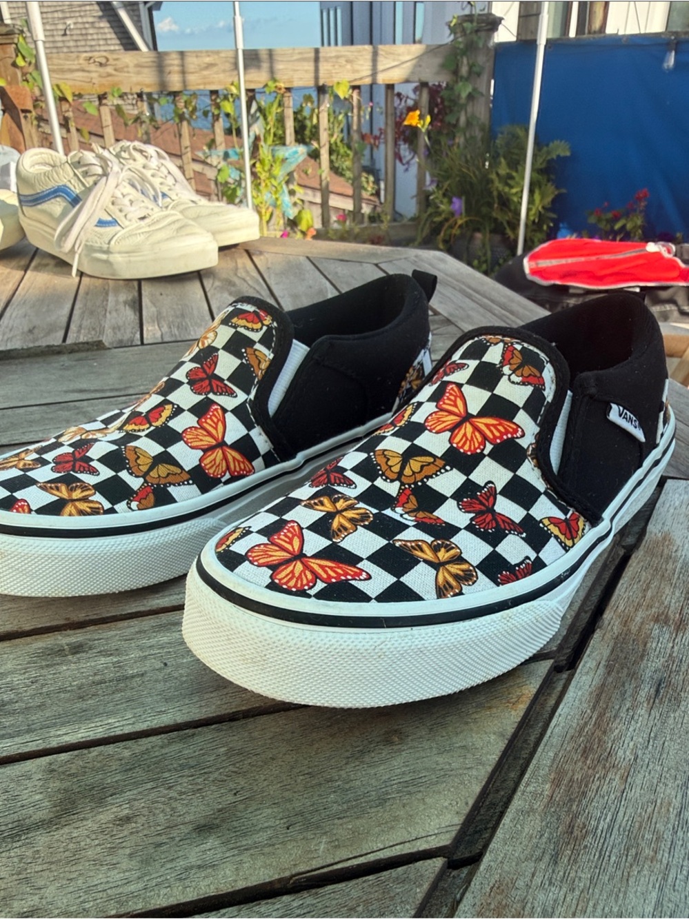 Vans Kids Slip-On Sneakers - Black Checkerboard with Orange and Gold Butterflies